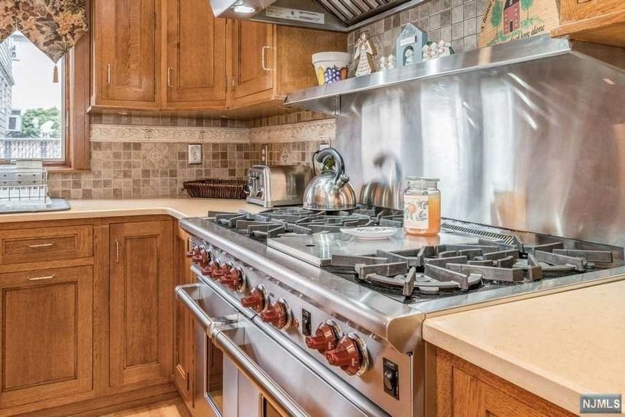 Pristine, Well Maintained 4 Bedroom 3 Bath Colonial in Nutley, Home Features A Den, Formal Living Room & Dining Room, A Massive Eat In Kitchen With A Wolf Range/Hood and Kitchen Aid Appliances, Wood Floors, Wood Burning Fireplace and A Full Finished Basement, Central Air, Central Vac & Sprinkler System. If You Love To Cook This Kitchen Was Made for You!!!! Not Only Does It Have The High End Appliances Etc. But Also A HUGE Kitchen Island To Prepare All Your Food, Plenty Of Room to Grow In This Lovely Home.