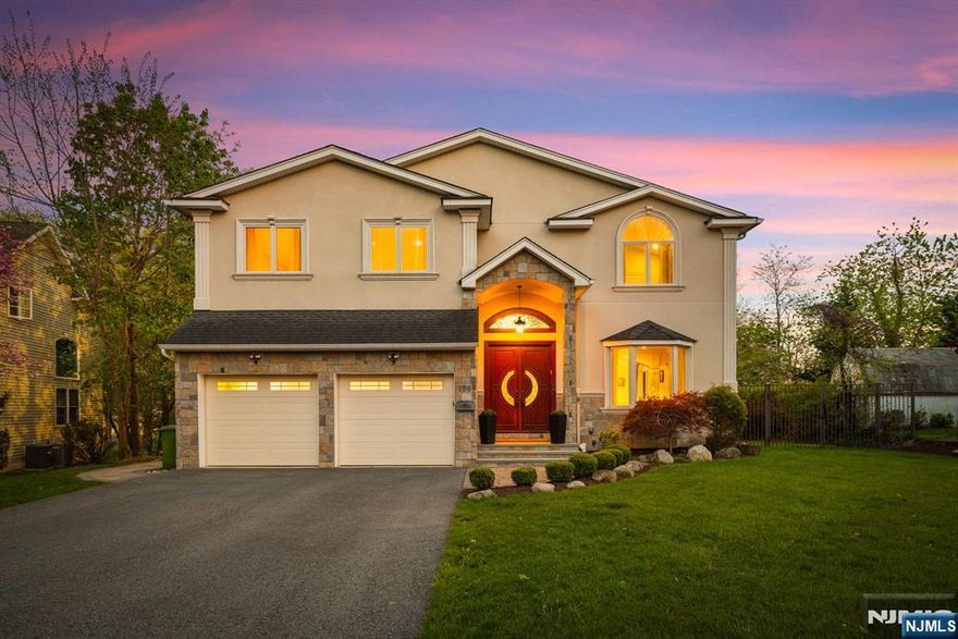 Rare Eastside Gem. Timeless Elegance on Over Half an Acre! Set on a magnificent 0.51-acre lot with a sprawling, park-like backyard, this elegant 4,900 SF custom home offers 5 beds and 4.5 baths. A thoughtful floor plan features expansive living spaces, a sleek eat-in kitchen, main-level en-suite bedroom, and an outdoor entertainerâ€™s dream: patio, fire pit, and built-in grill station with bar. Upstairs, the sunny primary suite boasts dual WICs and spa bath, plus 3 additional bedrooms, an office, hallway lounge, and laundry room. The spacious lower level offers endless potential with 9-foot ceilings and bath rough-ins. Luxurious amenities include radiant heated floors, Grohe fixtures, a full-home generator, low-maintenance solar panels, and more. A showcase of timeless elegance, ideally located near top schools, shopping, dining, and commuter routes, this rare Eastside opportunity blends privacy, luxury, and location. A true Paramus treasure!