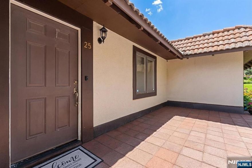 Welcome to the elegant "CLIFF HOUSE" overlooking the Hudson River Palisades. Mediterranean duplex townhome community with sweeping NYC views conveniently located close to shopping along Anderson Avenue and Edgewater shopping centers, NJ Transit Bus Stop to NYC directly in front of building entrance. This 2 level, 2 bed/2 full bath townhome features 1849 sq ft w/attaced full size 2 Car Garage, Terrace on main floor, patio on lower floor. Main Floor: 2nd bedroom, Jack & Jill bath, Kitchen w/skylight and cut out breakfast bar, large LR/DR w/WB fireplace (as is) and large balcony with NYC View. Lower level: Garage, Primary bedroom with ensuite, 2 large closets, sliders to glass enclosed heated sunroom, Laundry/utility room, multiple hallway closets plus under stairway storage.