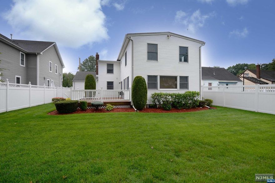 Welcome to this spacious and expansive 3000 sqft home featuring 5-bedrooms, 3-full bathrooms, and 2-half bathrooms. On the main level, this deceptively large home boasts a living room, dining room, bedroom, bathroom, and large eat-in kitchen featuring granite countertops, solid maple cabinets, sliding glass door leading to the deck and well-maintained backyard, a family room and a convenient 1/2 bath. Upstairs, you'll find a well-appointed primary bedroom suite, complete with an en-suite bathroom, 3 additional bedrooms and another full bathroom offer plenty of space. Storage won't be an issue either, as this home provides ample closet space throughout. The fully finished basement has been expanded to include a versatile rec room and a family room, convenient half bathroom, large laundry room with folding station, and generous storage areas add to the functionality of this home. Located close to Milnes Elementary School and TJ Middle School, shopping, restaurants & transportation