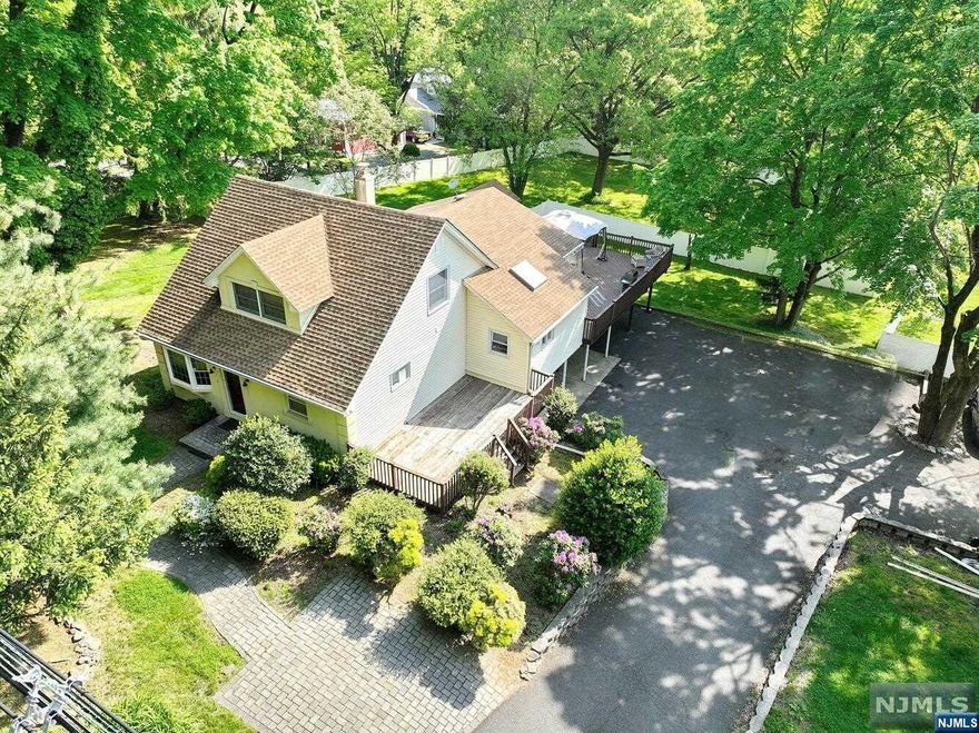 Welcome to this custom 5 bedroom, 2 bath colonial home in sought-after Washington Twp. The first floor features a living room and an open concept kitchen with island, dining room and family room. Three bedrooms and a full bath complete this level. The second floor boasts the primary bedroom with large closets and ample storage space. The ground level offers an ideal extended living opportunity with a family room, bedroom, kitchen, den/office, full bath, laundry and an outside entrance. The newer large deck with hottub beckons you to relax and unwind as you overlook the vast fenced rear yard, perfect for your furry friends, hosting unforgettable gatherings and fostering playtime adventures. This home has many amenities including hardwood floors and central air. Don't miss out on the opportunity to see this wonderful home!