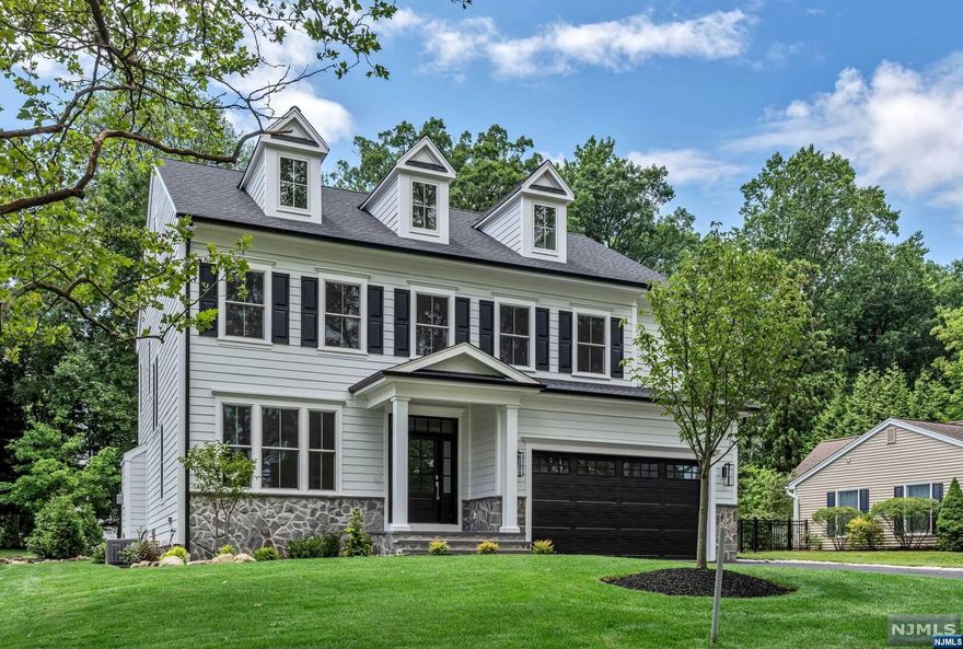 Completed to perfection! Welcome to 5 Townsend, a stunning, 5-bedroom, 5.5-bathroom home located in Florham Park, NJ. Situated in a sought-after section of town - proximate to Route 24, Morristown Airport, and charming downtown Madison - this residence offers four floors and over 5,000 sq. ft of finished space. Flooded with natural light, the first floor features an expansive great room with custom entertainment wall, gourmet kitchen equipped with state-of-the-art appliances and oversized island, and dining room with direct patio access. The innovative floor plan offers tremendous lifestyle flexibility with its den, flex room and pocket office. The second floor features an owner's suite with two walk-in closets and a luxurious en-suite bathroom, plus three additional spacious bedrooms, one of which is a junior suite with en-suite bathroom. The third floor features a fifth bedroom and full bathroom. Not to mention a fully finished basement! All this home is missing is you!