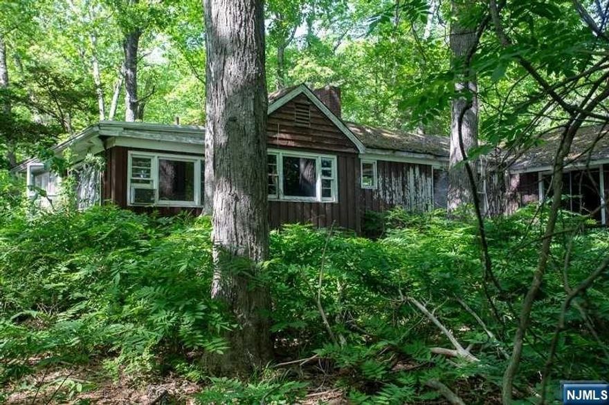 Nestled in the heart of the Morse Lake community, lies a beautiful piece of lakefront land, waiting to be transformed into a stunning oasis. This property is the perfect place for those seeking a tranquil & peaceful retreat. At the center of this magnificent property stands an old house that has seen better days and is now in need of major renovation or tearing down and rebuilding. The house is down to the studs. While the house may be in disrepair, the potential of this land is limitless. There is no information on the well and septic. Assume that both need to be replaced. The new owner has the opportunity to design and build their dream home from foot print. This lakefront property boasts a large & spacious lot, allowing ample room for a sprawling residence, outdoor entertaining areas, gardens, and more. There are stone walls and steps on the property. The Morse Lakes community offers a clubhouse and beach access, perfect for socializing.