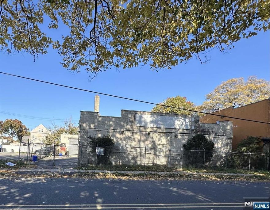 Excellent investment opportunity. Great location, ample space for storage and parking. 7,500 sq. ft. Previously used as an autobody shop . Office area with bathroom, and waiting room. Partial unfinished basement. Main warehouse has no roof due to fire. Electric has been upgraded.