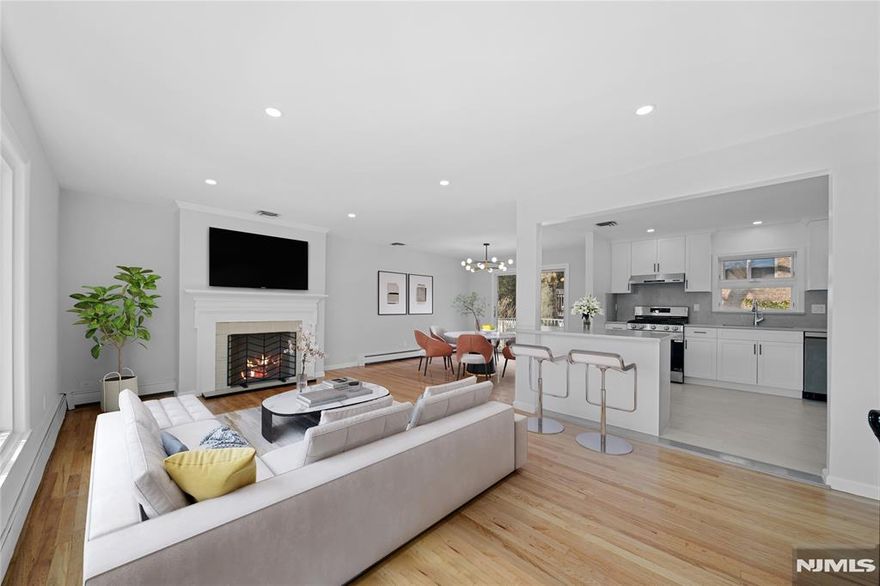 Welcome to this beautifully renovated east-south facing 3-bedroom, 2.5-bathroom split-level home in highly desirable Englewood Cliffs. Thoughtfully updated with modern finishes, this home offers a spacious and functional layout with bright, open living areas. The gourmet kitchen features sleek cabinetry, brand-new appliances, and quartz countertopsâ€”perfect for everyday living and entertaining. A direct sliding door from the dining room leads to the deck, creating a seamless indoor-outdoor flow. The primary suite boasts a stylish en-suite bath, while the additional bedrooms are generously sized. A fully finished lower level provides extra living space, ideal for a family room, home office, or gym. Enjoy the convenience of all-new mechanical smart systems and two oversized attached garages. Ideally located near NYC, top-rated schools, and local amenities, this move-in-ready gem is not to be missed!