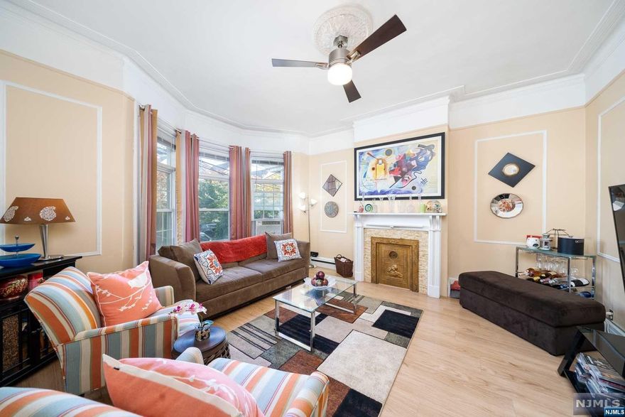 This charming, well maintained 2 family house with a porch is located in a highly desirable, quiet neighborhood in Weehawken on a tree lined street with a large private backyard perfect for BBQs & entertaining! Both units have a beautiful decorative fireplace, ceiling fans, eat in kitchens, laminate flooring throughout and video doorbells for easy access. The first floor unit has 3 bedrooms and 1 bathroom with direct access to the backyard and an open living area, kitchen with stainless steel appliances, granite countertops, drinking water filtration and an updated modern bathroom. The second floor unit offers a spacious living area with 4 bedrooms, 1 bath, recently updated. The partially finished, full basement is great for storage or expanding the first floor unit. The house has a water filtration system. Nice size lot 25x 95. Conveniently located, close to all restaurants, shops, Hackensack Reservoir, parks, NJ bus Transit. Great for investors or live in one and rent the other