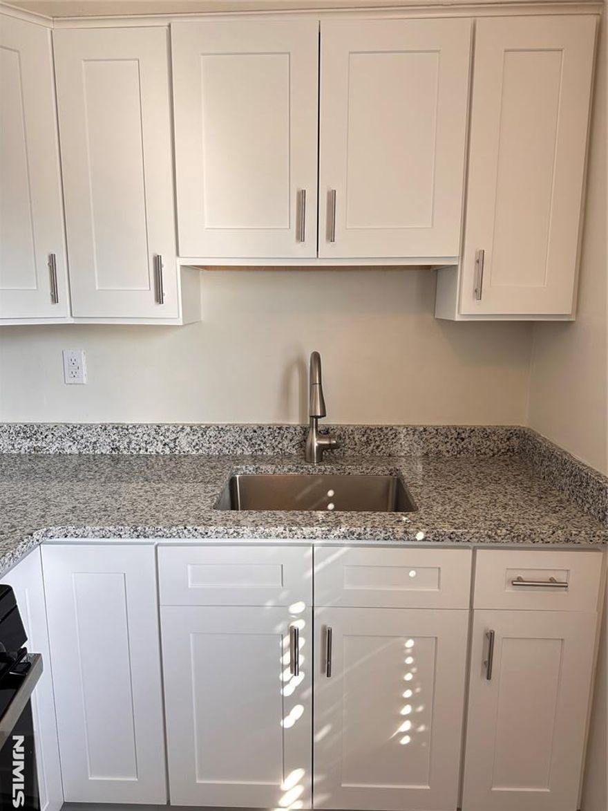 Welcome to 1-bedroom, 1-bath apartment located on the second floor offering comfort and convenience in a prime location. The unit features a spacious layout, hardwood floor. The bathroom and kitchen are updated. Also, the entire unit freshly painted. Coin-operated laundry located in the basement. Never worry about parking with your own assigned space included (12B). Guest parking is also available. Water and trash removal included in rent. Tenant is responsible for gas, electricity, and cable/internet services.The complex is located just steps from shopping, parks and dining. The bus to NYC stopping right across the street going to the Port Authority Bus Terminal. NO PETS, please. Interview, proof of income, proof of identity and NTN credit check is required. Do not miss this opportunity to live in a commuter-friendly location with everything you need nearby!