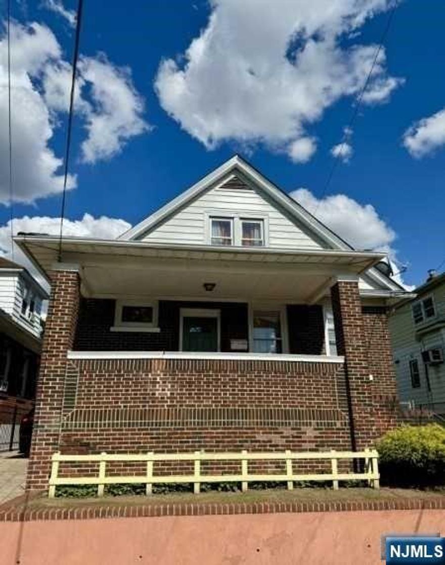 Nice 2-family home with a finished basement, driveway and well maintained backyard, close to public trans and major highways