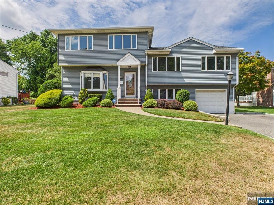 Beautifully Maintained Expanded Split Level home with Versatile Layout. This stunning 4-bedroom, 3.5-bath home offers style, space, flexibility for todayâ€™s lifestyle & multi-generational living. Step into a welcoming entry foyer and an open-concept main level filled with natural lightâ€”featuring a spacious living room with a bay window, elegant dining area, and an updated kitchen perfect for entertaining. Upstairs, find a primary suite with a private half bath, two comfortable bedrooms and a full bath. The third level is a dream suite complete with its own living room, kitchen, bedroom, full bath and a balcony overlooking the backyard. The lower level includes a den/office, garage access, laundry, and another full bath, while the finished basement offers a large recreation room, storage, and utilities. Outdoor living is easy with a paver patio and a spacious backyard ideal for gatherings! Impeccably cared for and thoughtfully designed, this home delivers comfort, versatility, and charmâ€”all in a sought-after location. Close to schools, transportation, shopping and more!!