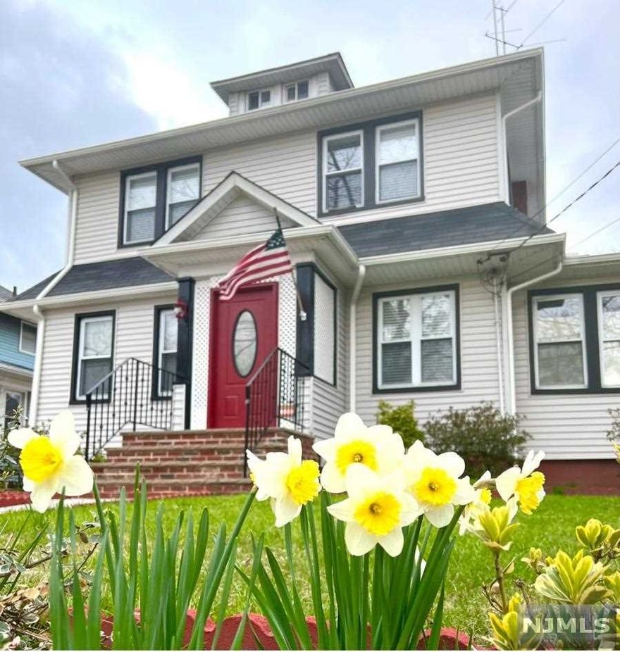 Welcome home!! This move in ready home is close to transportation schools and shopping. Walk into a lovely living room with wood burning fireplace for cozy winter nights. First floor also has dining room, kitchen and a den plus a full bath! Second floor has three bedrooms and another full bath. Added bonus is the walkup attic for plenty of storage or even office space. Finished basement has a half bath.Lovely backyard and a brand new detached garage. Don't miss out!!