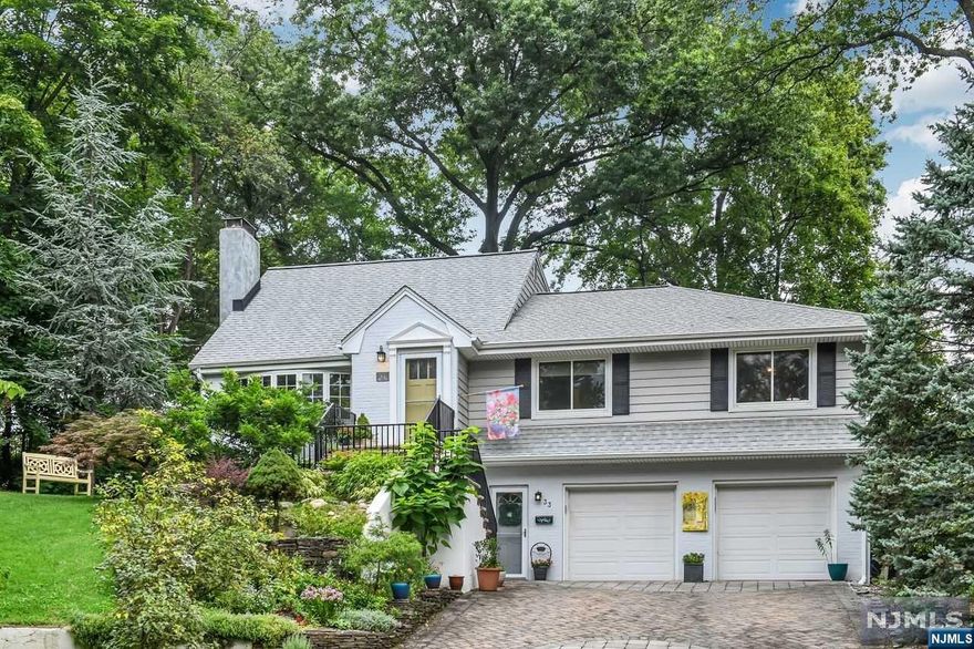 Expanded 4BR/3.5BA ranch. Private cul-de-sac in Byrd School neighborhood. Picturesque entry to foyer, formal LR w/WB fireplace opens to formal DR and granite casual dining peninsula showing off the must-see chef's kitchen overlooking the deck and rear gardens. Bonus sunrm/breakfast rm w/slider to deck, inviting views and light. Bedroom wing boasts first of two primary suites, two more bedrooms and hall bath, then up the private staircase is the second primary BR w/en suite bath/SS, huge walk-in closet with access to attic space, second walk-in closet. Lower level provides access to the great mudroom entrance, two-car att gar w/opener, large bright rec/office/music/media rm, large utility/storage rm offers additional finished space possibilites. Central Air, pretty wood floors, three full baths serve the 4 bedrooms plus powder room for the lower level. Luscious specimen plantings throughout private feeling landscaped park-like property, wide paver driveway, patio, deck.