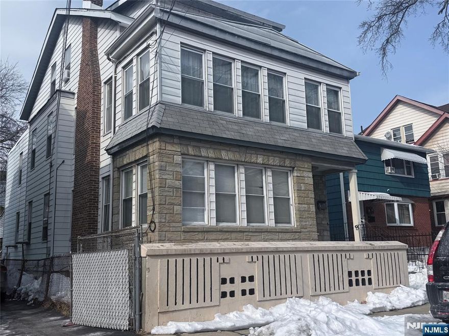 A large two unit house with a bonus attic with living room and a large one bedroom and full bath. All hardwood floors and in move-in condition. Great for owner occupant or investment.