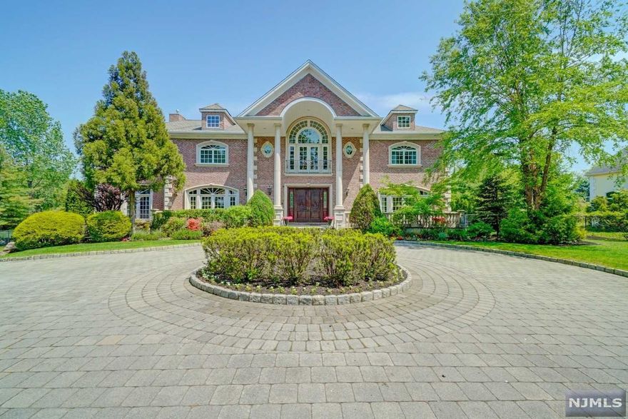 Magnificent sprawling estate in prestigious Alpine. Brick construction w/ front, rear & 2nd floor stone terraces. Heated in-ground pool w/ waterfall. Conveniently located 8 mi from NYC w/ Blue Ribbon schools & lots of anonymity. Enter thru the grand foyer w/ double wrought iron staircases to the 2nd fl interior balcony that overlooks the Great Rm w/ gas fireplace. The 1st Floor ft/ 11' ceilings, huge formal Dining Rm, Guest Rm, 2 Powder Rms, Music Rm, formal Living Rm & Library. Modern Kitchen ft/ large dining area, grand center island, Viking & Miele appliances & a Butler Station that leads to Dining Rm. Outdoor terrace connects the Kitchen, Great Rm & Library. Primary Suite w/fireplace + 4 ensuite Beds & walk-in Closets on 2nd Floor. Sauna, Wine Cellar, Movie Theater, Bed, Full Bath on Lower Level.