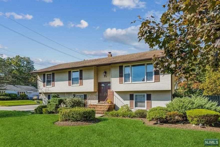 Corner property home front is on Moss Road . Some features of the home include an updated Kitchen with SS appliances, updated Baths, Master Bedroom with a full bath, Family Room SGD to the, Paver Patio , Hardwood floors and a first floor Office. Please note that half of one of the garages is used for the office. Can easily be changed back to a 2 car. Don't miss this Move-in ready home so close to everything. NYC transportation right outside your door.