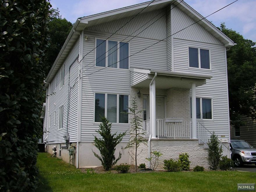 What a rare find!! Most 2 families are old and do not have an open floor plan. This home was built from the foundation up in 1996 and features a open floor plan. The bedrooms are all good size and have double door closets. The master bedroom is huge and has 2 double door closets. The first floor has sliders out to a deck, and use of a huge unfinished basement. The second floor features a vaulted ceiling in the dining rm and living room with skylight. Both floors have their own laundry hookups, and central air and parking.