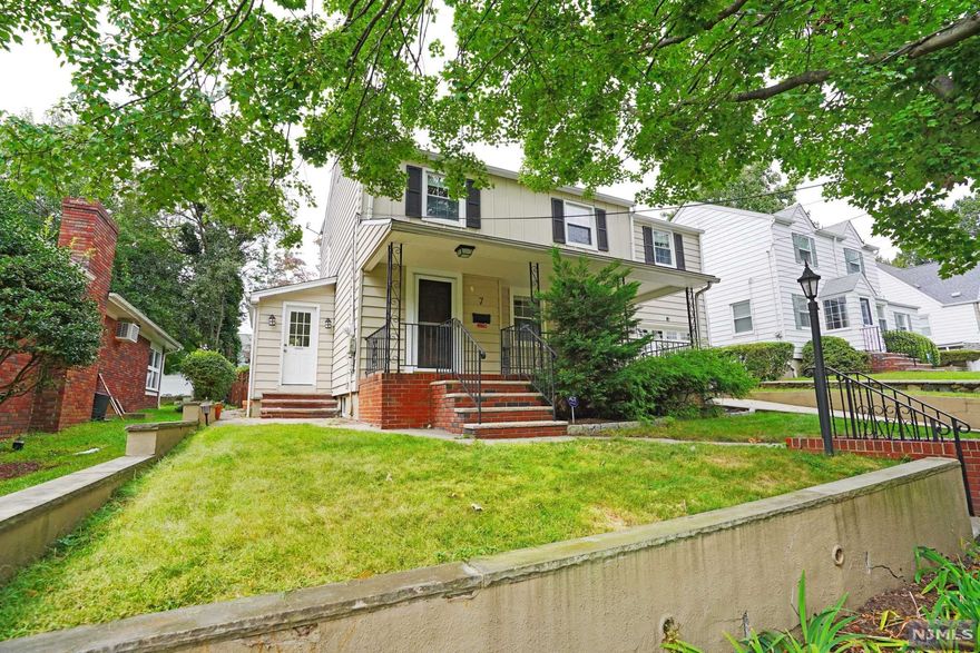 Beautiful spacious side hall colonial located in center of town. Seconds away from schools, transportation, & shops. Charming front porch opens into the generously sized rooms with convenient mud room off kitchen which offers newer stainless steel appliances. Hardwood floors throughout, deck, patio, fenced in yard, storage shed, & security system. Stunning backyard oasis perfect for entertaining and relaxation.
