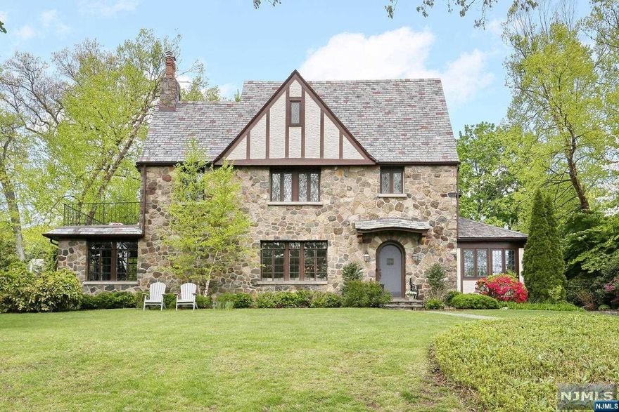 1920s Tudor is set on almost half acre in the Old Country Club neighborhood of Ridgewood. This home has been renovated and updated for today's lifestyle whilst retaining the fine architectural details of the period. Custom kitchen featuring Viking, Sub-Zero and Thermador Stainless Steel Appliances, including Sub-Zero wine cooler and Franke fixtures. Radiant heat in kitchen, mudroom and den. Architectural custom molding and trim throughout. Primary Bedroom Suite & Bathroom w/access to private balcony. Full finished Basement with a newly added full bathroom, gym, kitchenette, "hang out space" and lots storage. Full House Filtration System, security system, lighting and irrigation. Smart-home technology with surround sound wired for Sonos. Large fenced back lawn and bluestone patio. Close to schools, houses of worship, shopping & easy NYC commute!