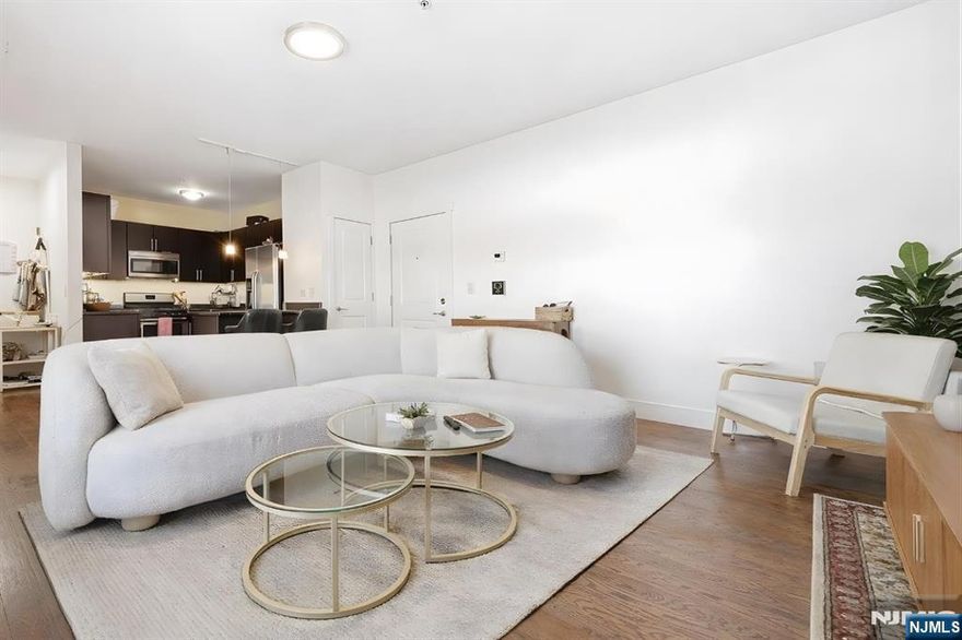 Welcome to modern living in the heart of Newark. This stylish one-bedroom condo, built in 2020, combines contemporary design with everyday comfort in a well-maintained elevator building. Inside, high ceilings and oversized windows fill the space with natural light, creating a bright and airy atmosphere. The open living and dining area flows into a sleek kitchen with stainless steel appliances, granite countertops, and ample cabinetry. Hardwood floors run throughout, while generous closets and smart storage solutions make the layout both functional and inviting.The location offers the perfect balance of urban convenience and neighborhood charm. Enjoy easy access to Branch Brook Park and its famous cherry blossoms, as well as the Newark Museum of Art. Major medical centers, including University Hospital, are nearby, and the Prudential Center is just a short trip away for sports, concerts, and events. Commuters will appreciate nearby NJ Transit and PATH connections, along with quick access to major highways for travel throughout North Jersey and into NYC. The neighboring city of Harrison is also close by, featuring Red Bull Arena and a growing waterfront district with dining and nightlife. This home is ideal for those seeking modern finishes, great storage, and a connected lifestyle.