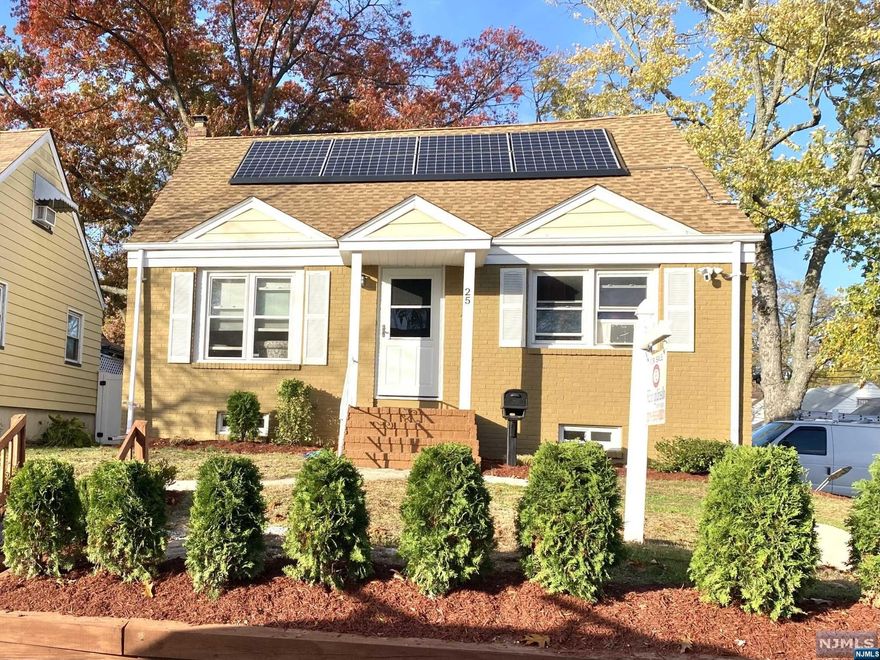 This is a quaint 4 bedroom cape cod style home with a new kitchen and a lovely dining area with sliding glass doors to a large deck. There are many new windows and a new heating system and hot water tank. The part finished basement has a laundry room. There is a one car attached garage and parking for two other cars. This is a corner property. There are Energy efficient solar panels on the roof. Flood insurance may be possible.