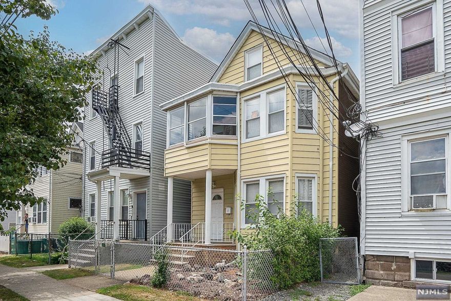 Well maintained two family home with large fenced in yard, walk in attic and basement. Downstairs is fully renovated with a full bathroom, two bedrooms, kitchen, and living room. Upstairs has two bedrooms, full bathroom, kitchen, living room, parlor area and a walk out porch. Entire property is fenced in. Street Parking is available. Close to shopping and transportation.Both units are vacant. Agent is related to the seller