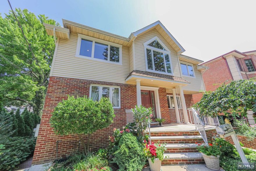 WELCOME TO THIS IMMACULATELY MAINTAINED HOME ON PRESTIGIOUS ABBOTT BLVD WITH MORE THAN 2300 SQ FT OF LIVING SPACE. COMPLETED WITH HARDWOOD FLOORING THROUGHOUT THE 2 STORY. ENTRY FOYER WELCOMES AND LEADS YOU TO A FORMAL LIVING ROOM WITH LARGE CUSTOM WINDOWS, A BEAUTIFUL EAT IN KITCHEN AND CENTER ISLAND, GRANITE COUNTERS, THIS LEADS YOU TO THE LARGE DECK AND YARD, WITH BREATHTAKING NATURAL VIEW PERFECT FOR ENTERTAINING. ALSO ON FIRST FLOOR IS THE LARGE FORMAL DINING ROOM, FAMILY/TV ROOM AND HALF BATH. NEW 2ND STORY WAS ADDED RECENTLY WITH HIGH CEILING & SKYLIGHT. INCLUDES MASTER BEDROOM/MASTER BATH/WALK IN CLOSETS, 2 LARGE BEDROOMS, 1 FULL BATH, LAUNDRY ROOM & OFFICE/FAMILY ROOM WITH A BREATHTAKING VIEW. ONE CAR ATTACHED GARAGE, DOUBLE PARKING SPACE ON EACH SIDE OF THE HOUSE, LEADS YOU TO FULL FINISHED BASEMENT WITH FULL BATH, LAUNDRY ROOM, SUMMER KITCHEN, 5 CLOSETS WITH WALKOUT TO LARGE YARD & COVERED PATIO. CLOSE TO NYC,BUSS,FERRY, PARKS, SCHOOLS,SHOPPING,PARKS..LOW TAXES!