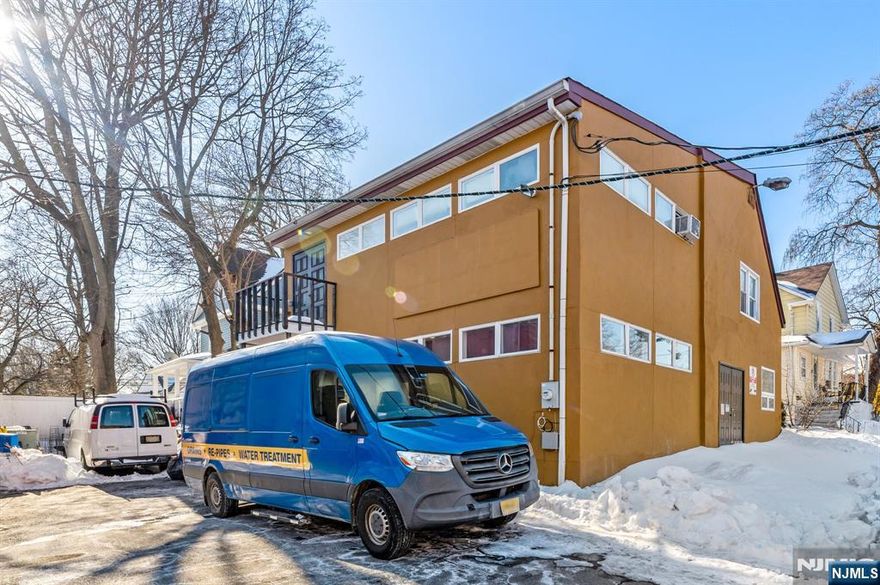 Great location for a freestanding office with warehouse space, ideal for professional contractors and service-based businesses. The property features four separately divided spaces across two stories, connected by a spiral staircase leading to the second floor. Includes one half bathroom and two off-street parking spaces. Situated in a prime area with convenient access to major highways and NYC transportation.