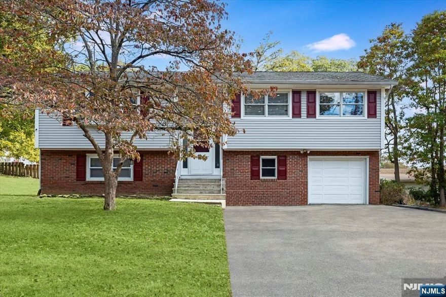 Beautifully updated and move-in ready, this 3-bedroom, 2-bath, two-level home offers modern style and flexible living just moments from the lake. The open-concept upper level features a bright living area that flows seamlessly into the dining space and a sleek, modern kitchen perfect for everyday living and entertaining. Three comfortable bedrooms and a full bath complete the upper floor. The spacious lower level adds versatility with a large family room, home office or potential guest suite, full bathroom, and convenient laundry area with direct garage access. Enjoy outdoor living on the deck overlooking the yard ideal for relaxing or hosting gatherings. With electric heat, central air, and all appliances included, this turnkey home combines comfort, convenience, and location in one attractive package. Set in a desirable neighborhood near the lake and local amenities, this is an opportunity not to be missed!