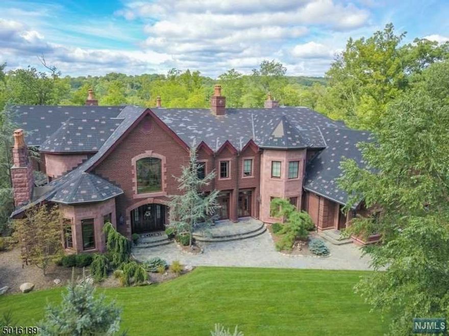 Timelessly elegant, Turnkey and located in Smoke Rise, this spectacular custom built estate is set on 1.63 acres with magnificent winter lake views and only a short walk to the beach. Inside: 26 rooms, 7 bedrooms, 7 full and 2 half baths, 5 fireplaces, gleaming wood floors, double-height ceilings with walls of glass, a 1,346 bottle wine cellar and a 4 bedroom in-law-suite. Exquisite architectural detailing highlight grandly proportioned sun filled rooms. With an artful combination of elegance and comfort, this .is a home for all seasons and every occasion. Outside: Resort style atmosphere.