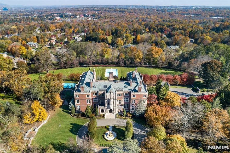 Welcome to the Crocker Mansion, a rare masterpiece 25 miles from New York City. Originally constructed in 1907, this historical estate has been meticulously restored, apprx 50,000 sq ft of spectacular living space, situated on 12+ acres & views of the picturesque Ramapo Mountains. This exceptional property boasts 21 luxurious BRs, 26 bathrms, rare woodwork, exquisite stonework, & unparalleled craftsmanship. The reception rms are grand, including a stunning Great Hall & library. Perfect for entertaining w/ a restaurant-style kitchen & prep kitchen. Leisure options abound w/ a billiard rm, game rm, wine rm & theater. With a focus on wellness, there is an indoor pool, spa, steam & sauna, massage rm, salon & gym. The outdoor amenities are impressive, w/a stunning pool, cabana, gardens, fountains, tennis ct, guest house, gate house & an 8-car garage. This one of a kind estate offers a lifestyle of unparalleled grandeur & comfort, come own a piece of history. Photos from previous listing.