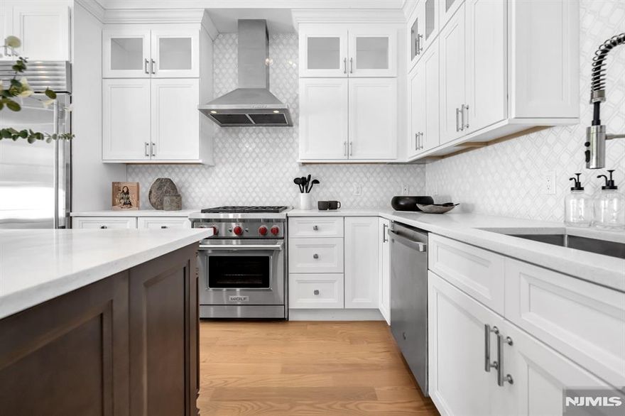 Stunning luxury interior townhome in Gabriel Estates, a boutique community in the heart of Paramus. Built just a few years ago, this residence has 3 bedrooms, 2 full baths, and 2 half baths, the home offers soaring 10-ft ceilings on the main level and 9-ft ceilings upstairs, creating a bright, airy ambiance. The gourmet kitchen showcases Sub-Zero and Wolf appliances, quartz countertops, and sliding glass doors that open to a private, fenced backyard. The impressive primary suite includes a massive walk-in closet and a spa-like bath with a Jacuzzi tub, oversized shower, and double vanity. A fully finished lower level extends the living space with a spacious recreation room and a custom wet bar perfect for entertaining. Outdoor living is complete with a private patio and yard, all just minutes from the Garden State Parkway, Route 17, world-class shopping, and Paramusâ€™ top-rated schools.