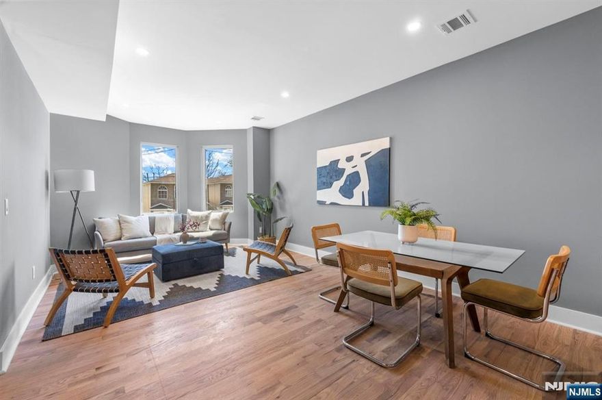 Stunning fully renovated 2-family duplex-style home in Bergen-Lafayette. Each sun-drenched unit spans 2 levels with 4 bedrooms, 3 full baths, featuring high ceilings, recessed lighting, and designer finishes throughout. Unit 1 offers a finished walkout basement, full bath, and access to a great size backyard. Unit 2 boasts NYC skyline views. Enjoy open-concept living, sleek kitchens, and spa-like bathrooms. Total of 8 bedrooms, 6 baths â€” ideal for owner-occupants or investors seeking strong income potential / house-hack opportunity. Located in a great neighborhood, near the Light Rail with easy access to NYC, parks, and local dining.