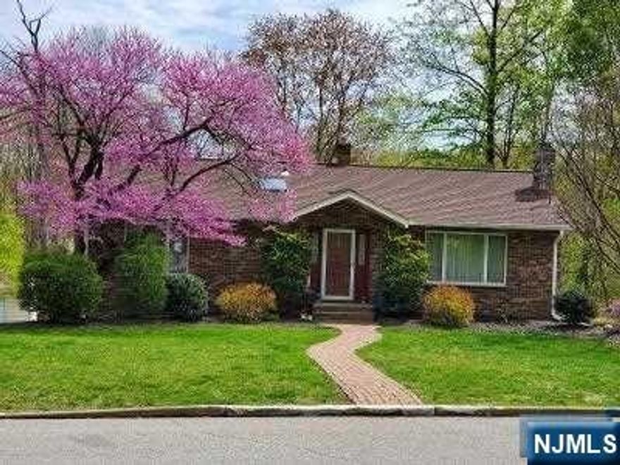 Bigger then it looks! Wonderful brick and vinyl Ranch, 1st floor Nice eat in kitchen w/ skylight, with 1/2 wall opening to dining room, Lg L/R, primary brm, 2 more brms, full bth w/ skylight. Full finished walk out basement with lg pantry,3 finished Rec rooms, one w/flp, 1/2 bth, laundry rm, beautiful park like property with above ground pool, hot tub, 2 teir babbling ponds! Central A/C, Central vac, gas baseboard 2 zone heating, pull down attic! Too much to list Must see!