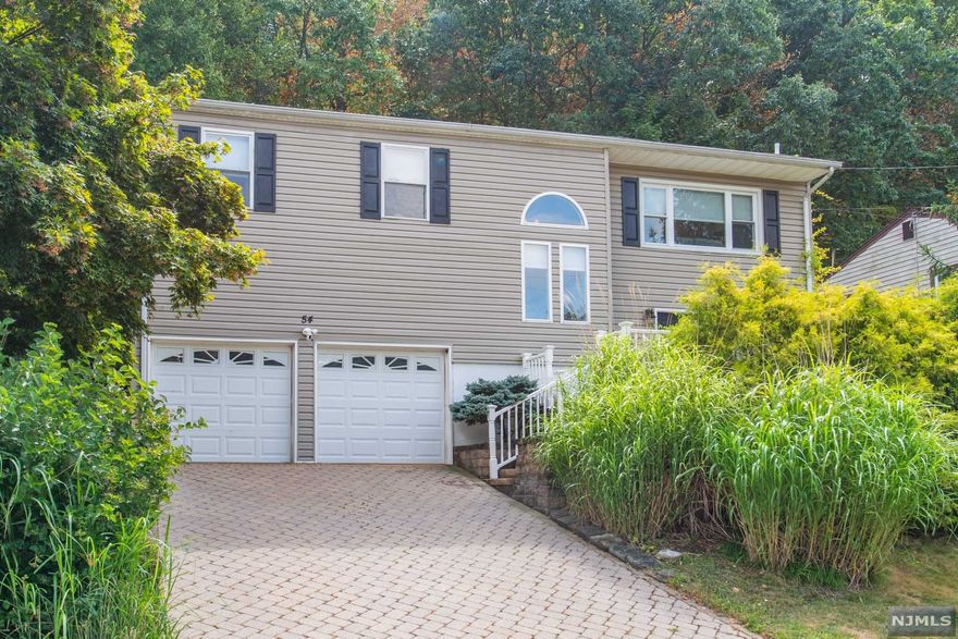 This unique style custom built home in the Birchwood section boasts over 1800 square feet of living space. As you enter from the beautiful front porch with Smart Lock keyless entry into the lower level you will be received by a lovely entry foyer/mudroom. This lower level also has a bedroom/office, laundry room, full bathroom and the entrance to the 2 car garage. Up the stairs welcomes you with high ceilings and skylights entering into the living room and dining room with hardwood floor throughout. Entertaining is easy with the open concept, large kitchen with granite counter tops and a sliding glass doors that leads out to the large private patio. This is the ideal location close to the mall and dining and is in walking distance to the Blue Ribbon Birchwood Elementary School.