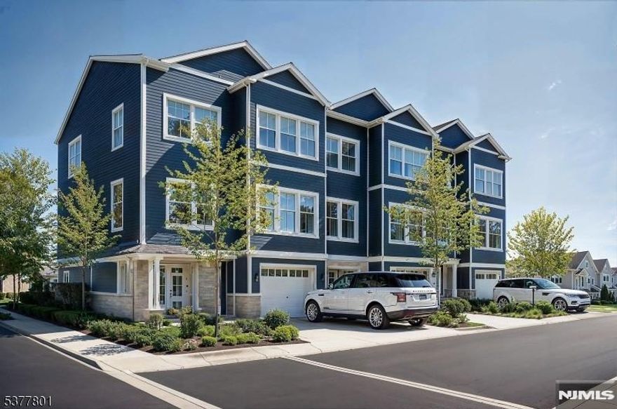 Brand New Modern Luxury " Townhouse " No HOA! This new 3-level, 2,627 sq. ft.townhouse ombines modern design with everyday comfort. Andersen High Performance windows, 9' ceilings, and hardwood floors enhance the open main level, featuring a designer kitchen with quartz countertops and full quartz backsplash, 2-tone cabinetry w/ center island, and all GE stainless steel appliances. The kitchen flows into the dining and living areas, creating a great space for both entertaining and daily living. The primary suite offers a spacious bathroom with double sinks, a glass-enclosed walk-in shower, and a generous closets. You will also find a 2nd bedroom, full guest bath, washer/dryer and flexible office or den. The 1st level includes a recreation/media room, powder room, and full laundry room equipped with full size GE Washer/Dryer & sink. A private 14' x 12' deck, extensive professional landscaping with sod and shade trees creates a beautiful setting. Exterior includes Stone, Hardie Plank siding, paver driveway, and insulated garage with opener. Parking accommodates 3 vehicles. Additional highlights include designer Kohler fixtures and lighting, 2-zone central A/C, natural gas heat, and fire sprinkler on all floors. With no HOA fees, a 10-year homeowner warranty, and a location minutes from NYC transit, dining, shops, and top-rated schools, this home delivers style, function, and long-term value.