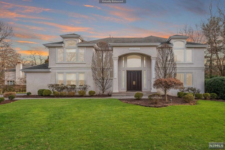 Magnificent colonial family home located on a peaceful picturesque street. This sprawling home offers an expansive floorplan for everyday family living & comforts. Featuring first-floor family room with wet bar, formal living room with charming masonry gas fireplace, formal dining room, and a spacious sun-drenched open kitchen with granite countertops, breakfast bar & eat-in area. 4 spacious bedrooms + master suite with walk-in closets & spa-like bathroom with jacuzzi. Finished basement with in-law suite + full kitchen, walk-in wine cellar & abundance of storage. This home is situated on a manicured lawn with an underground irrigation system, custom outdoor lighting, a patio off the kitchen, and a beautiful brick paver driveway to the 2 car garage.