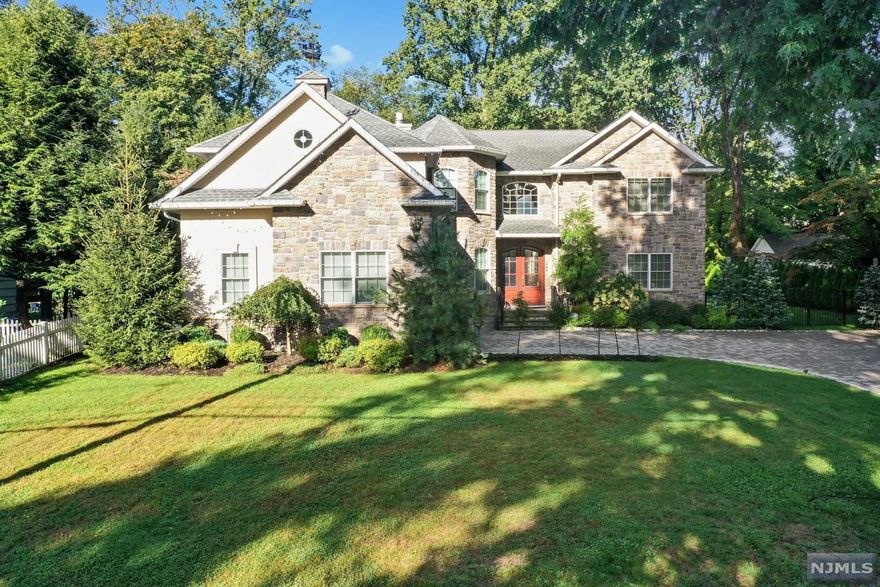 Every once in a while a Unique Home becomes available...This is your opportunity to own a Custom Built home that is only 4 years old! This magnificent European-influenced home was built using the best materials. Featuring 5 full bedrooms all w/ adjoining bath, Private office, GR w/ 2 sided fpl opens to the FR & Kitchen space and also has Cathedral ceiling, & wall of windows. The 5900+ Sq foot house has 3 full levels of living space. Features include the 4.5 Baths featuring Porcelanosa tiles, kitchen w/ quartz countertops, high end appliances, wrought iron spindles, 12 zone radiant heat throughout, 4 zone CAC, Electric car charger, Electric panel for generator, Set on .9 acres the grounds feature a saltwater gunite pool w/ jacuzzi, large private deep yard, access to county park and composite deck off fam room. Conveniently located close to schools, county park/bike path, shopping, vibrant downtown, and bus to NYC. This is a must see to fully appreciate!