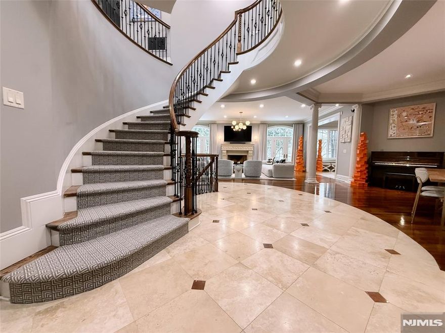 Exceptional 4BR, 4 full & 2 half bath townhome in the sought-after Bellaire Townhomes community overlooking Alpine Country Club. Enter through a dramatic 2-story foyer into an open-concept main level featuring a custom gas fireplace and access to a private patio with golf course views. The eat-in kitchen offers stainless steel appliances, center island, and separate dining area. French doors lead to a custom office. Elevator access to all floors. The primary suite includes a gas fireplace, spa-like bath with soaking tub, large shower, double vanity, and expansive closet. Two additional en-suite bedrooms plus a fourth bedroom complete the second level. Finished lower level with rec area, theater, full bath, and private room with adjacent full bath ideal for guests or flex space. Includes an attached two-car garage with interior access.