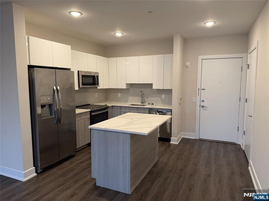 **FIRST MONTH FREE on a 13-month lease + one parking space included! - for occupancy commencing on or before 2/1/26!** Welcome to the Metro, Fort Lee's newest luxury building. All amenities INCLUDED in the rent, and REDUCED rent security offered to qualified applicants - The Metro features a variety of upscale, spacious floorplans. high-end residences fully equipped w/ modern kitchens w/ stainless steel appliances, quartz countertops, full islands & tiled backsplashes, open living/dining areas, shades on all windows, modern bathrooms & a full-sized washer & dryer in each unit. The Metro features a large elegant lobby, outdoor courtyard, outdoor terrace/garden, large club room and a on-site fitness center, which includes the Echelon Reflect mirror, electric car charging stations & INDOOR (covered) parking garage w/ direct elevator access to all residences for uncompromising security. Pet friendly (LB limit & fees apply)! Tenants pay ALL utilities! PARKING: 1st space INCLUDED IN THE RENT(!); Additional space - $150/monthly! Virtual tour available upon request!