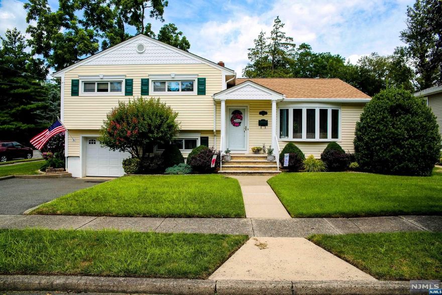 Exquisite split level is in move in condition and ready for new owners to call home. Beautiful condition inside and out! The spacious living room with the big bay window and formal dining room are light and bright and feature gorgeous floors and a great open floor plan for today's style of living. The kitchen features warm oak cabinetry and plenty of room for a table and chairs. The Primary bedroom features two closets and a private full bath. Two additional bedrooms are a nice size and both have double closets. The main bath has been updated and features a beautiful custom vanity. The lower level features a nice size family room, half bath, laundry room and outside exit to yard and patio! The basement has a great rec room, utility room and storage. This property is situated on a corner lot and is meticulously maintained! Plenty of room for summer entertaining and more! Newer roof and attached one car garage! Great location situated close to shopping and transportation!