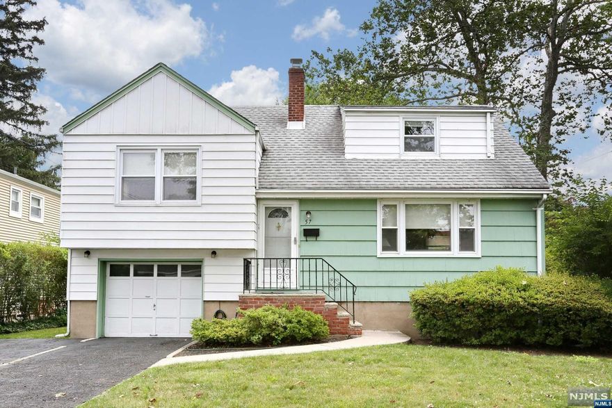 Fantastic split level home conveniently located in a great town with lots of community events! This very well maintained home has a newer heating system, CAC, HWH and roof. Hardwood floors throughout. Located on a pretty street with a private backyard. Easy commute to NYC. Don't miss out on this terrific home!