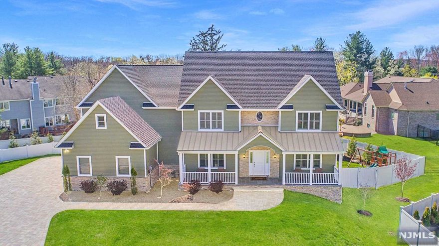 Beaut custom colonial with exquisite craftsmanship is perfect for NYC commuters. Over 4000 sq ft living space. Built in 2016 w/ the lower level finished in 2020, you'll find all the bells and whistles here, perfectly situated on a cul-de-sac in an enclave of elegant luxury homes. The open and sunlit floorplan, w/ family room w/ gas fireplace, has 9' ceilings, beaut. HW flrs, plantation shutters & crown moldings. Gourmet chef's kitchen w/ lg center island, SS appliances, custom cabinets & sliding glass doors to the deck overlooking fully fenced, prof. landscaped yard. Mud Room & access to 3 car garage. 2nd fl features a primary retreat w/ two walk-in closets & Spa Bath w/ shower, soaking tub, double vanity; three more bedrms (one en-suite) all with oversized closets, full hall bath, lg laundry rm. Huge finished lower level w/ high ceilings, pre-wired media/rec rm, wet bar, full bath, gym/office. Paver driveway, irrig system, 3 zone heating/cooling. Top rated schools. Move right in!