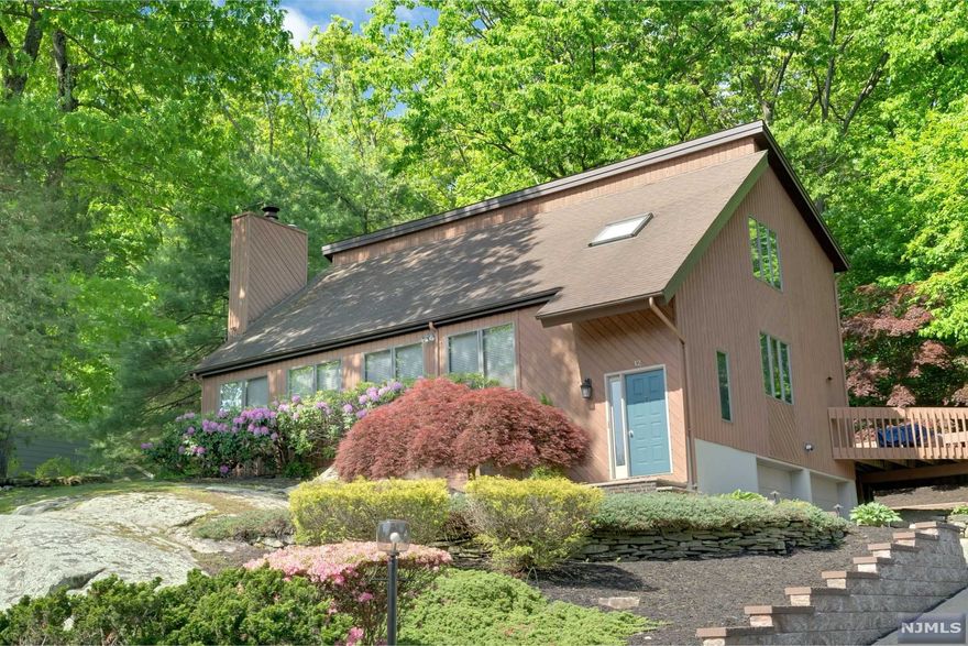 Come and see a most amazing, immaculate, contemporary with over 2600sq.ft. of living space in a great community with a much desired and highly rated school system. This home offers an open concept w/ a huge LR (27'3x15'6) w/ 2 story vaulted ceiling, wall of wndo's, skylight, wd. brng. Fpl & hdwd. flr; FDR w/hdwd. flr.; then lg. kitchen (17'2x9'2) w/cntr. island, nw. flooring & exit to lovely deck. 1st flr. completes w/MBR (15'5 x 15') & lg. FCTB. The 2nd flr has a lovely loft, a huge BR (15'5 x 19'3) can be Master; BR (12'10 x 11'8) & FCTB. The bsmt. offers laundry area, ,5 bth; family room (19 x 14'2) w/new premium crptg. and garage entry. Amenities & updts include 15 yr. young roof; Anderson wndo's; nw.water htr.; CAC 2 yrs. old; 200A elec.svc.; incredible frt. yard rock formation; beautiful private/level yard; 2 car gar. w/huge drvwy. and much more.