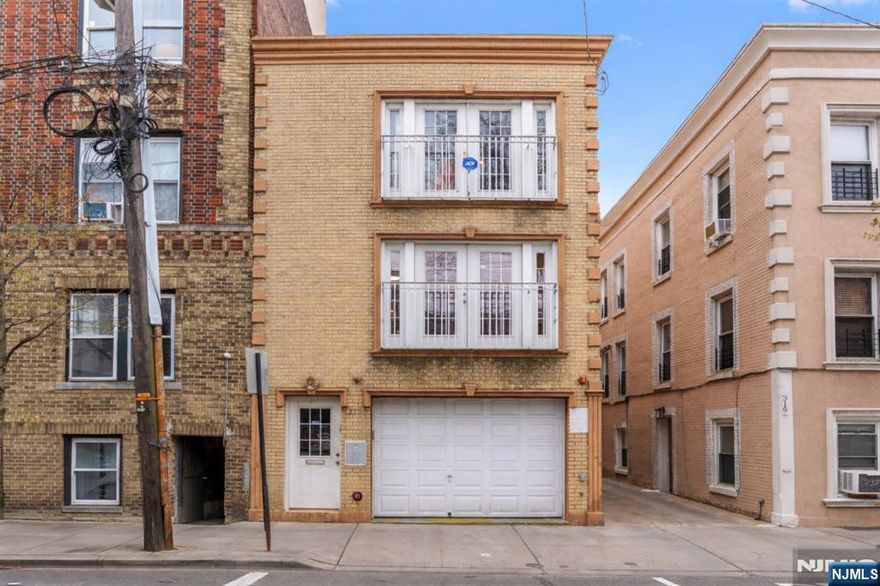 Welcome to 317 11th Street, Unit 2, a beautifully updated three-bedroom condo perfectly positioned for the Manhattan commuter seeking both convenience and comfort. Just minutes from Hoboken and a quick commute into NYC, this residence offers seamless access to the city while enjoying the charm of Union City living. The home features newly refinished hardwood floors, recessed lighting throughout, and an airy open layout with French doors that lead to a private balcony, allowing for abundant natural light and fresh air. The kitchen flows effortlessly into the living space, ideal for both everyday living and entertaining. A standout feature is the expansive private rear deck, exclusive to this unit, offering the perfect setting for morning coffee, intimate gatherings, or summer cookouts. The spacious primary suite includes two closets and a well-appointed en-suite bath, while additional highlights include in-unit washer and dryer and a dedicated parking space. This is a rare opportunity to own a move-in ready home that combines modern updates, private outdoor space, and unbeatable proximity to Manhattan.