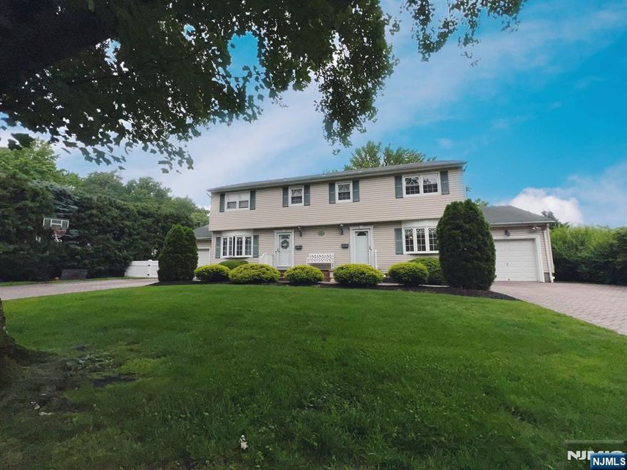 This rarely available half duplex is nestled in a highly sought-after Paramus neighborhood, where pride of ownership shines through in every well-maintained home. Ideally located near the middle and high schools, public library, and a nearby school bus stop, this home offers both comfort and convenience. This owner-occupied duplex boasts meticulous landscaping, a private backyard, and a spacious deckâ€”perfect for relaxing or entertaining. Inside, you'll find three generously sized bedrooms, two and a half baths, and gleaming hardwood floors throughout. The impressive great room features a vaulted ceiling, skylight, and sliding doors that lead to the deck, creating a bright and airy space. The eat-in kitchen is equipped with newer appliances and offers ample room for a dining area. A large living room, formal dining room, and a powder room round out the main level. Upstairs, you'll find three bedrooms and a full bath. The finished basement adds extra living space, complete with a kitchenette, storage, laundry area, and another full bath. Tenant is responsible for snow removal, gas, electric, and half the water. Landlord takes care of landscaping. Credit check, application, and proof of income a must. No pets.