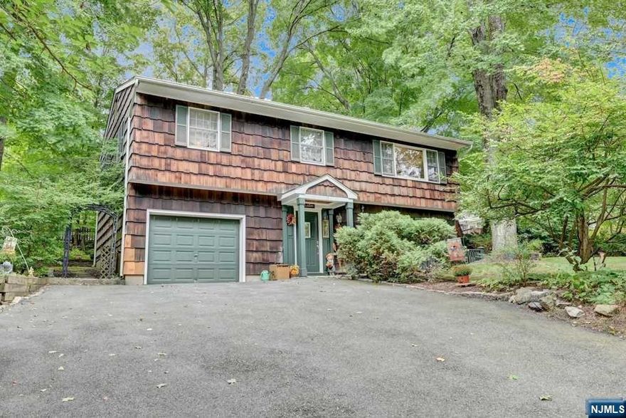 Welcome To This Lovely 3 Bedroom Raised Ranch with 1 Car Garage, Located in Desirable Erskine Lake! A Living/Dining Combo with Wood Burning Brick Fireplace and Hard Wood Floors! Living Room Features Large Picture Window That Provides Lots of Natural Light! Dining Area with Sliders Out to Deck That is Perfect for Entertaining with Stairs to the Back Yard! Country Kitchen with Skylight and Breakfast Bar Seating for 2! 2nd Floor Has 3 Bedrooms with Carpeting Over Hardwood Floors, and a Full Bathroom! Ground Level Has a Family Room/Den with Ceiling Fan, A Full Bathroom with Stall Shower, an Office/Bedroom and Laundry Room! Ground Level also has Garage Access! Erskine Lakes Offers Many Clubs to Join and Membership is Optional! Close to Shopping, Schools, Library, Highway Access, NYC Transportation and More! This One Will Not Last Long!