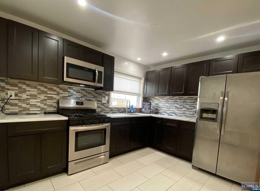 Newly renovated multi-family with finished basement. Full bathroom on each level with 1st and 2nd floor containing 3 bedrooms which include generous closet space and modern fixtures. Attached garage with plenty of additional storage plus yard space. Perfect investment opportunity for new owners.