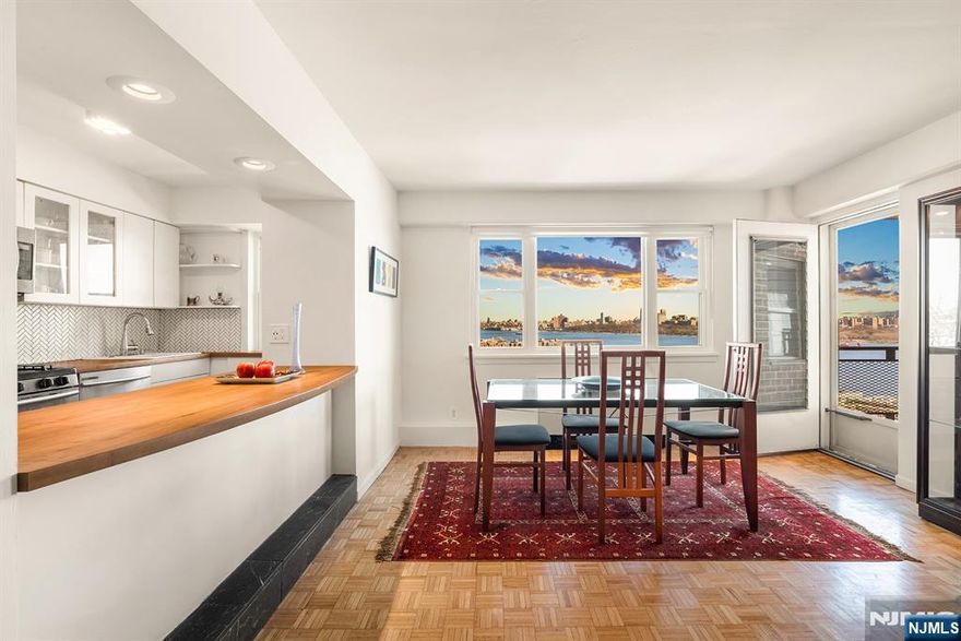 Balcony Bliss-Beauty over the River w/ sparkling NYC Skyline Views are yours in the Coveted Corner 2 Bedroom 2 Bath Condo. Step into Luxury Living with your own private Balcony. Soak up sensational NYC Skyline Views, plant a garden, dine al fresco or simply relax. This move-in-ready, rare corner layout boasts an abundance of new windows & sun light. Offering 1200+-sq. ft of Luxury living space w/ an elegant vibe. You'll experience shimmering views of countless NYC Landmarks including Iconic Empire State Building. Both cooking & hosting are a pleasure in the windowed Modern open kitchen, equipped with newer SS appliances, plenty of prep counter space & bistro seating for guests to gather. The serene & spacious primary bedroom suite offers exciting views of the NYC skyline everywhere. Find an elegant marble bath, floating vanity, large shower & spacious walk-in-closet . The East facing 2nd Bedroom offer glorious views, walls of closets for your wardrobe. Across the hall find 2nd marble full bath. Notable upgrades: New Windows, 3 New PTAC units, custom solar shades. HOA incl; ALL UTILIIES; Heat; A/C; Electric; Water; 1 Pking space, shared laundry on site, Live in-Super. A tremendous value. Seller paid capital improvements in full. NO PETS; ES/SVC pets are permitted. A Prime picturesque Parkside location surrounded by urban convenience! Only 8 miles to NYC, hassle free options are steps away! Don't Miss out! Contact Angela Cuciniello for Details 201.657-6084.