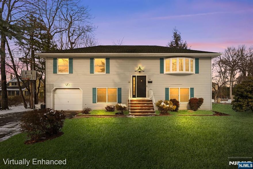 Expansive bi-level home offering over 2900 sf. Ideal for flexible living options in desirable Pequannock Township. Both kitchens and all 3.5 baths have been recently renovated. Spacious living and dining areas. Main level features east-in-kitchen opening to a four season room with cathedral ceiling, three bedrooms including a primary suite with double closets and a full bath, plus an updated main bath with double vanity, skylight and jetted tub. Ground floor offers a kitchenette wit granite counters, full bath, a half bath, bedroom with double closets and a private entrance. Also large main living area and a bonus room. Quiet neighborhood setting.