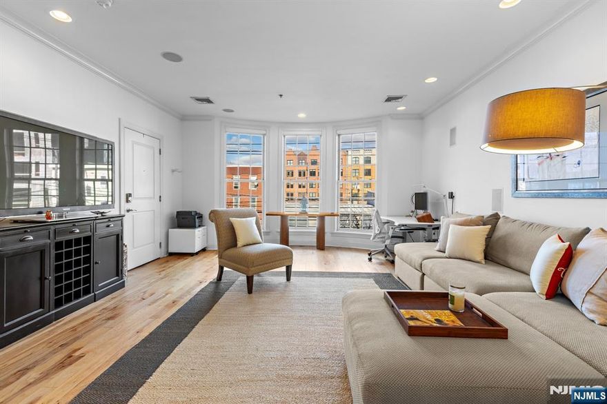 One-of-a-kind 1 bed, 1.5 bath brownstone condo at Liberty Harbor. Chefâ€™s kitchen has granite countertops, imported hardwood cabinetry, stainless steel appliances, pantry and breakfast bar. Spacious living and dining space features oversized bay windows, surround-sound in-wall speakers, and crown molding. Large bedroom includes custom walk-in closet and ensuite bath with double vanity and marble soaking tub. The half bath, in-unit washer/dryer, Nest thermostat, and gleaming American Hickory hardwood floors round out this perfect home. Liberty Harbor amenities include 24/7 doorman, fitness center, yoga room, club room with kitchen, theater room, game room, playroom, and a sundeck with jacuzzi and BBQ. Parking available for additional fee. Conveniently located only minutes from the Path train, light rail, ferry, and bus, as well as shops, restaurants, and everything Downtown Jersey City has to offer. Move-in ASAP.