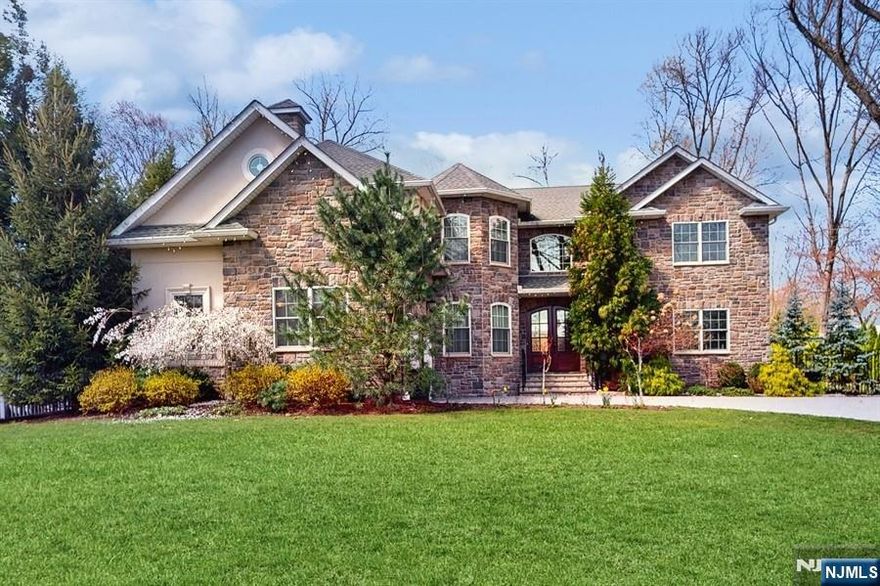 Step into a rare opportunity to own a custom-built European inspired estate on 0.9 acres of pristine land in one of Ridgewoodâ€™s most sought-after neighborhoods. Built in 2017 with no detail overlooked, this 5 bed, 4.5 bath architectural gem blends refined craftsmanship and cutting edge technology. Inside, youâ€™re greeted by 10 foot ceilings, a dramatic two story great room with a floor to ceiling bookshelf. A private office and a versatile guest suite on the main level. The kitchen features high-end appliances, seamlessly flowing into a stylish family room. The primary suite is your private retreat, offering a sitting room, spa-like bath and two oversized walk-in closets. Upstairs also includes a bedroom with ensuite bath, double vanity bedrooms and a laundry room. The finished basement offers a home theater, gym, game room, or media lounge. Outdoors amenities include a gunite heated pool, built-in spa, paved patio and an access to a creek. Call 201.600.6218 for questions